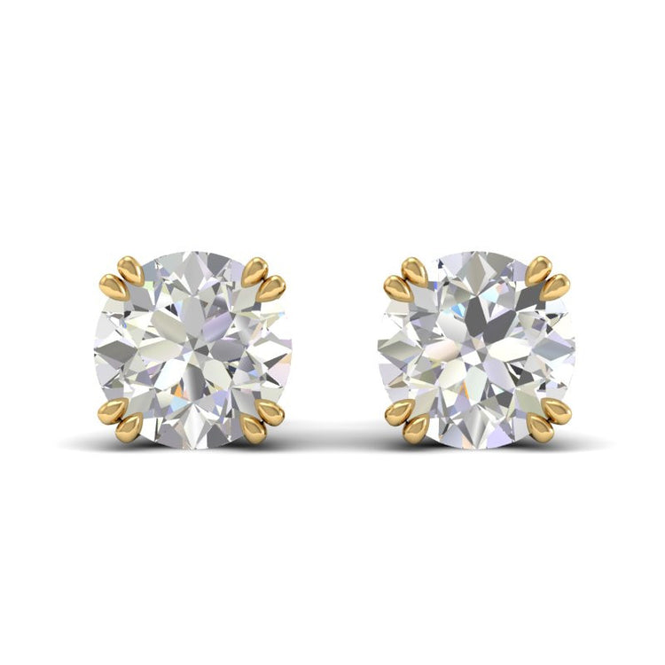 Double prong Diamond stud earrings in 18k yellow gold